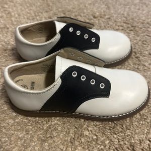 Navy and white “buster browns.” Size 11